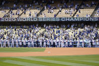 The Los Angeles Dodgers are honored for their 202 World Series Championship before a baseball game against the Washington Nationals, Friday, April 9, 2021, in Los Angeles. (AP Photo/Marcio Jose Sanchez)