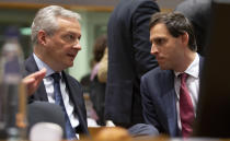 French Finance Minister Bruno Le Maire, left, speaks with Dutch Finance Minister Wopke Hoekstra during a meeting of EU finance ministers at the Europa building in Brussels, Tuesday, Feb. 18, 2020. EU finance ministers meet Tuesday to discuss tax havens. (AP Photo/Virginia Mayo)