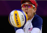 April Ross from the US controls the ball during the women's Beach Volleyball semi-final against Brazil's Larissa Franca and Juliana Silva on The Centre Court Stadium on Horse Guards Parade in London on August 7, 2012, for the London 2012 Olympic Games. USA won 2-1 AFP PHOTO / DANIEL GARCIADANIEL GARCIA/AFP/GettyImages