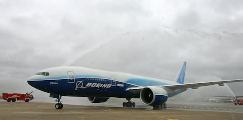 Boeing's 777-200 LR is given the water canon treatment at Heathrow - Credit: GETTY