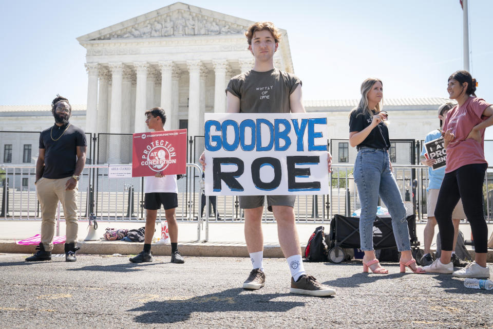 Noah Slayter, 20, of Manassas, Va., poses for a portrait while protesting outside the Supreme Court about abortion, Wednesday, June 15, 2022, in Washington. "Those on the abortion side like to purport that those in foster care could have a terrible life. Who is to say that they'll have a terrible life? The kids sleeping in the room across from me, there's people that think they should have been killed," he said, "previously the movement had one battle, a national one. And now we will have 50." (AP Photo/Jacquelyn Martin)