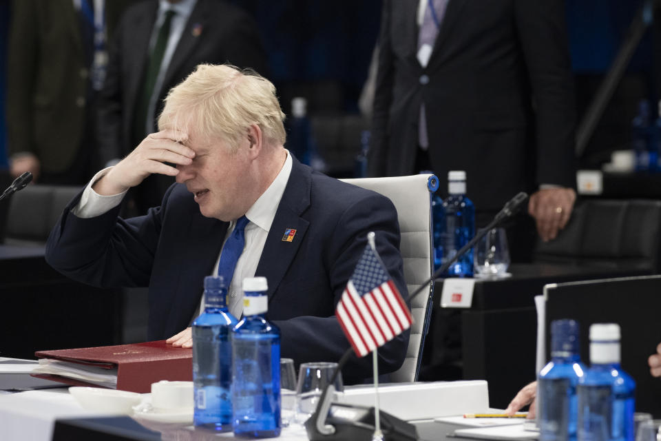 British Prime Minister Boris Johnson reacts at the start of the second plenary session of the NATO summit in Madrid, Wednesday, June 29, 2022. North Atlantic Treaty Organization heads of state will meet for a NATO summit in Madrid from Tuesday through Thursday. (Eliot Blondet, Pool via AP)