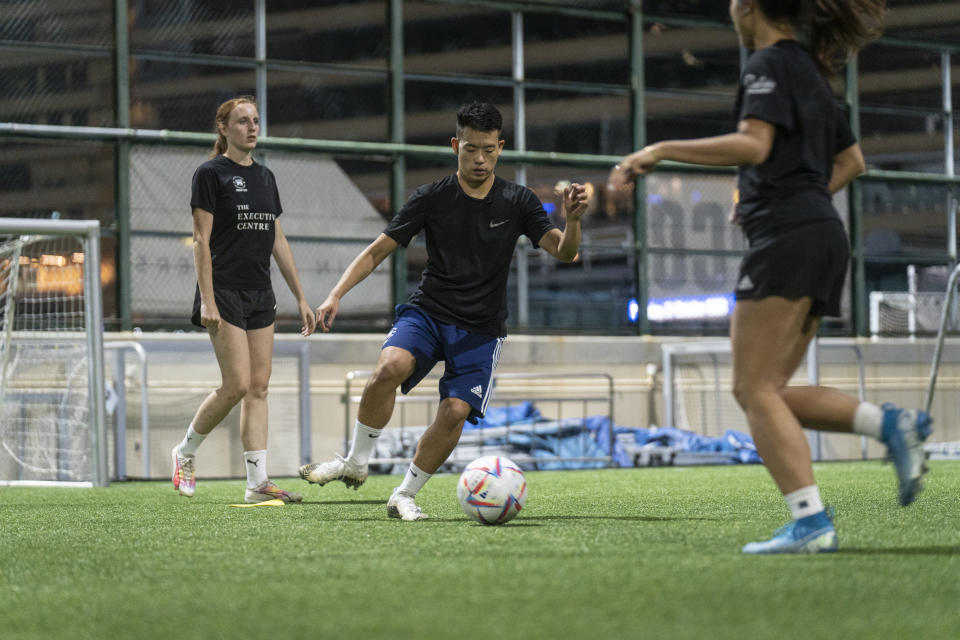 Emery Fung, center, volunteer of Gay Games attends a training session in Happy Valley ahead of the Gay Games in Hong Kong, Tuesday, Oct. 31, 2023. Set to launch on Friday, Nov. 3, 2023, the first Gay Games in Asia are fostering hopes for wider LGBTQ+ inclusion in the Asian financial hub. (AP Photo/Chan Long Hei)