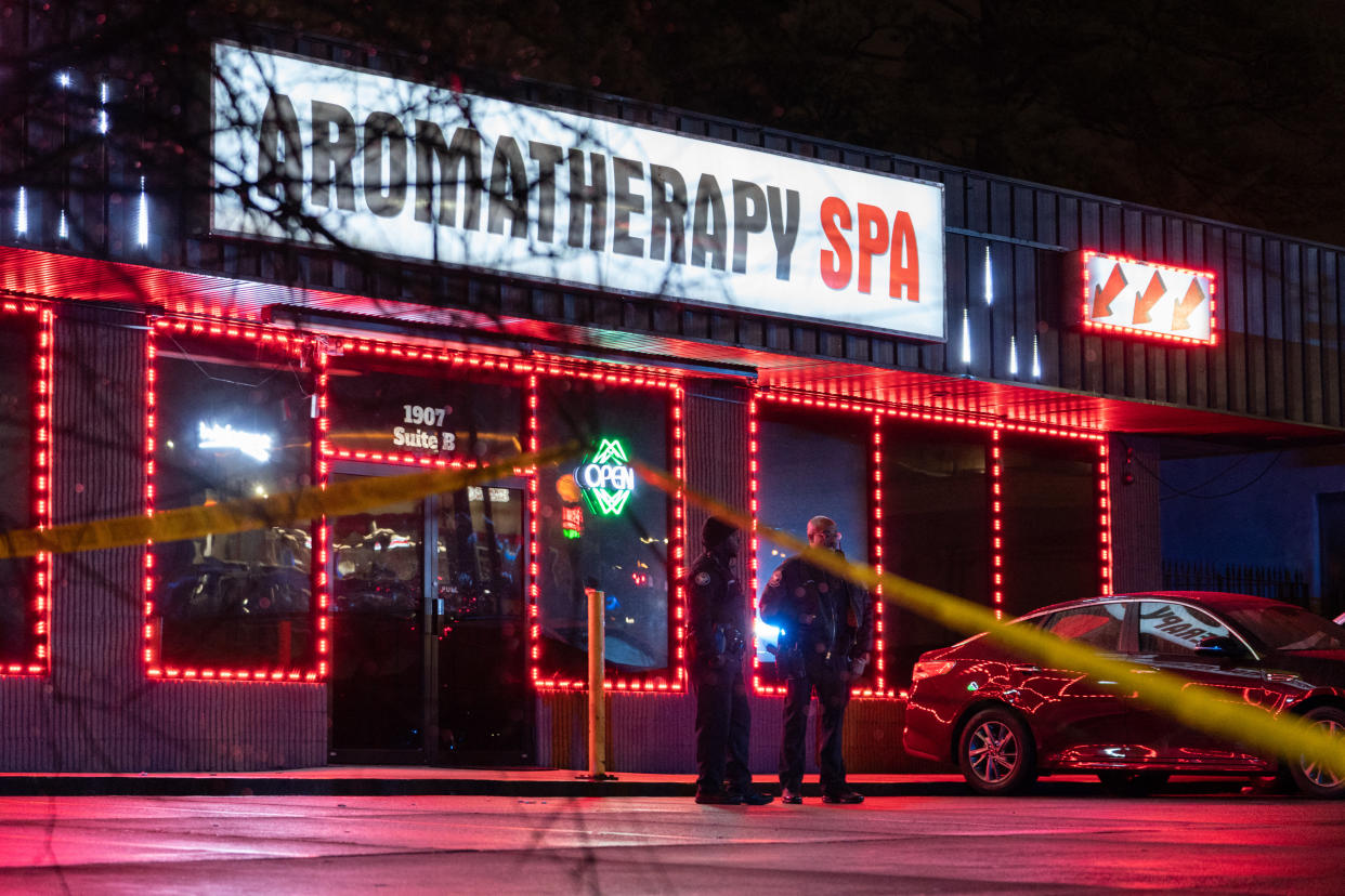 Law enforcement personnel are seen outside a massage parlor where a person was shot and killed on March 16, 2021, in Atlanta, Georgia. (Elijah Nouvelage/AFP via Getty Images)