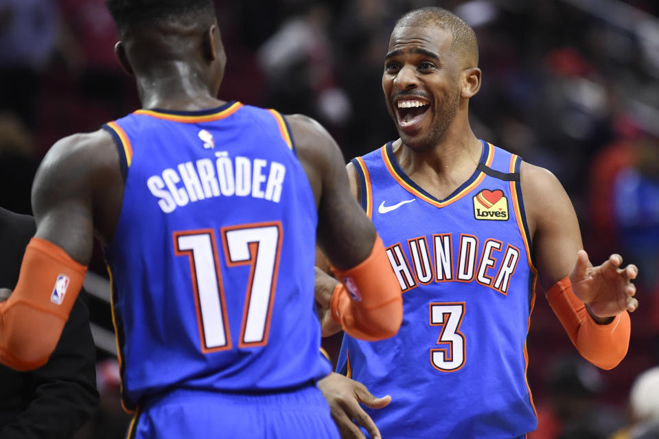 Oklahoma City Thunder guard Chris Paul (3) celebrates the team's win with guard Dennis Schroder in an NBA basketball game against the Houston Rockets, Monday, Jan. 20, 2020, in Houston. (AP Photo/Eric Christian Smith)