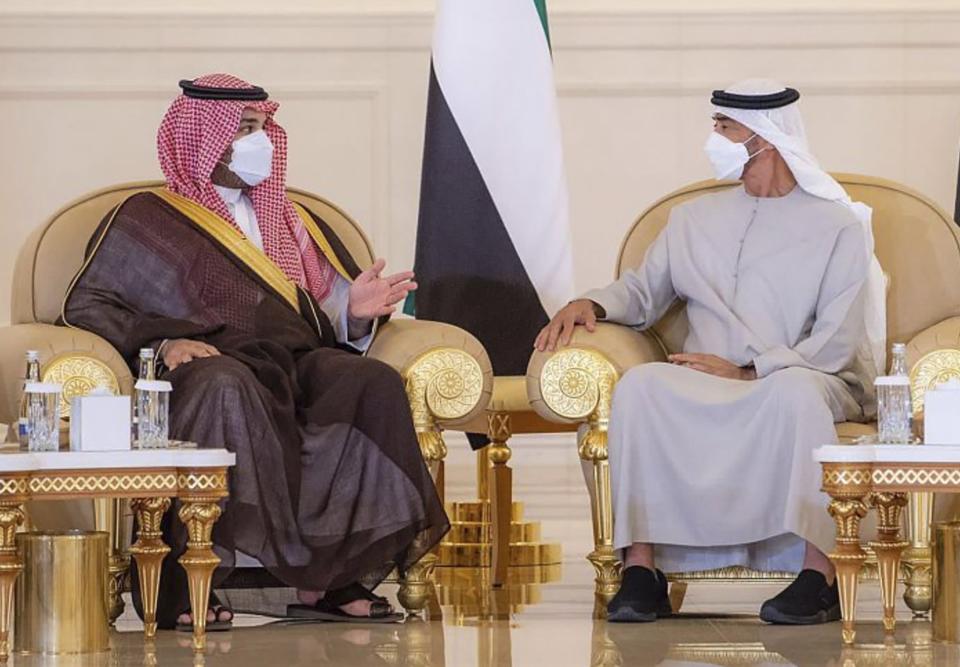 In this photo released by Saudi Press Agency, Saudi Crown Prince Mohammed bin Salman, third left, offers condolences to Sheikh Mohamed bin Zayed Al Nahyan, president of the UAE and ruler of Abu Dhabi, third, right, on the passing of Sheikh Khalifa bin Zayed Al Nahyan, the late president of the UAE, at the Presidential Airport in Abu Dhabi, UAE, Monday, May 16, 2022. (Saudi Press Agency via AP)