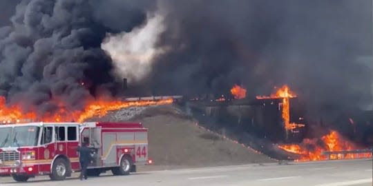 A tanker overturned and caught on fire in the intersection of I-465 and I-70 on Indianapolis' east side on Thursday, Feb. 20, 2020.