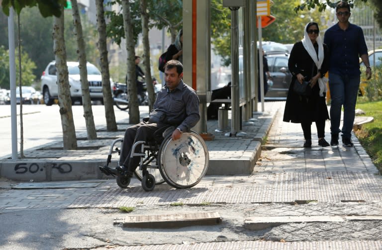 Uneven pavements are a problem for disabled people in Tehran