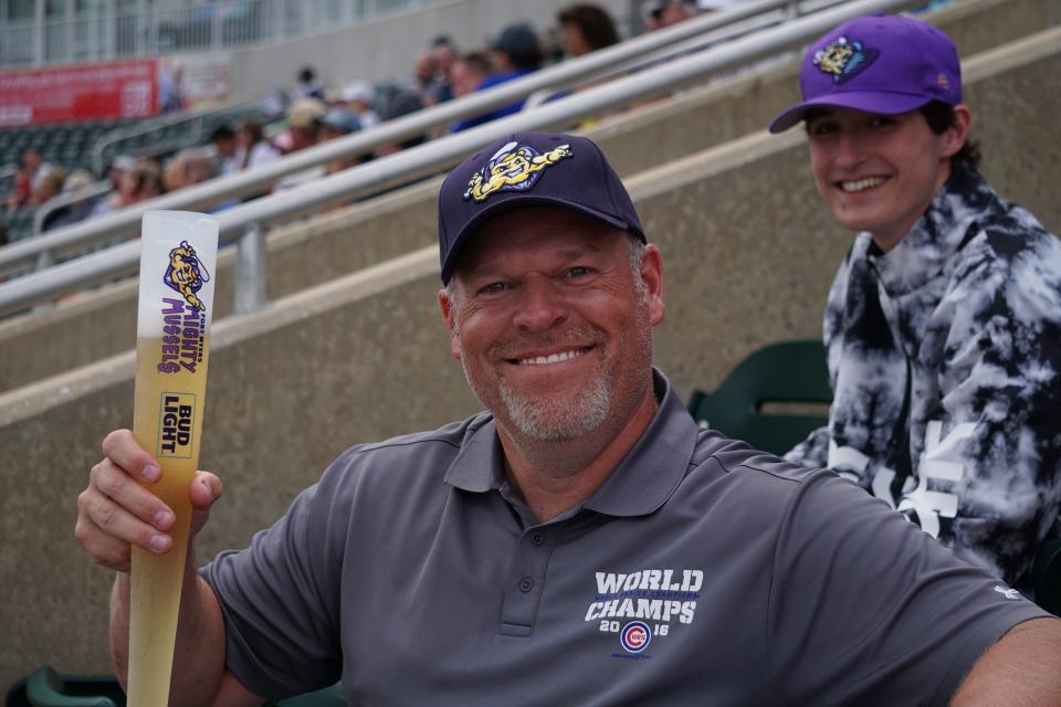 Mighty Mussels fan with a beer bat.