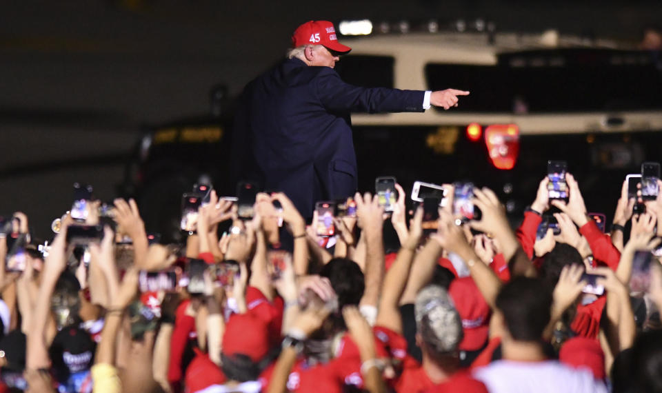 President Donald Trump leaves his campaign rally at Opa-Locka Executive Airport, early Monday, Nov. 2, 2020, in Opa-Locka, Fla. (AP Photo/Jim Rassol)