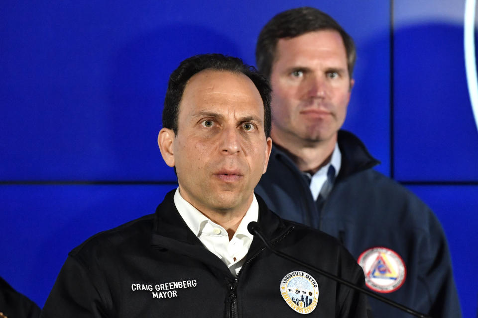 Louisville Mayor Craig Greenberg speaks to reporters during a news conference in Louisville, Ky., Monday, April 10, 2023. A shooting at the Old National Bank killed and wounded several people police said. The suspected shooter is also dead. Standing behind Greenberg is Kentucky Gov. Andy Beshear. (AP Photo/Timothy D. Easley)