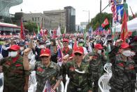 Veterans shout slogans during a rally against North Korea on Korea's Liberation Day in Seoul, South Korea, Monday, Aug. 15, 2022. South Korean President Yoon Suk Yeol on Monday offered "audacious" economic assistance to North Korea if it abandons its nuclear weapons program while avoiding harsh criticism of the North days after it threatened "deadly" retaliation over the COVID-19 outbreak it blames on the South. (AP Photo/Ahn Young-joon)