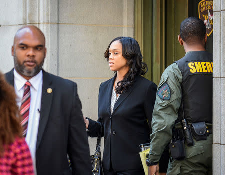 Baltimore City State's Attorney Marilyn Mosby (C) departs the courthouse on the first day of the Caesar Goodson trial in Baltimore, Maryland, U.S., June 9, 2016. REUTERS/Bryan Woolston