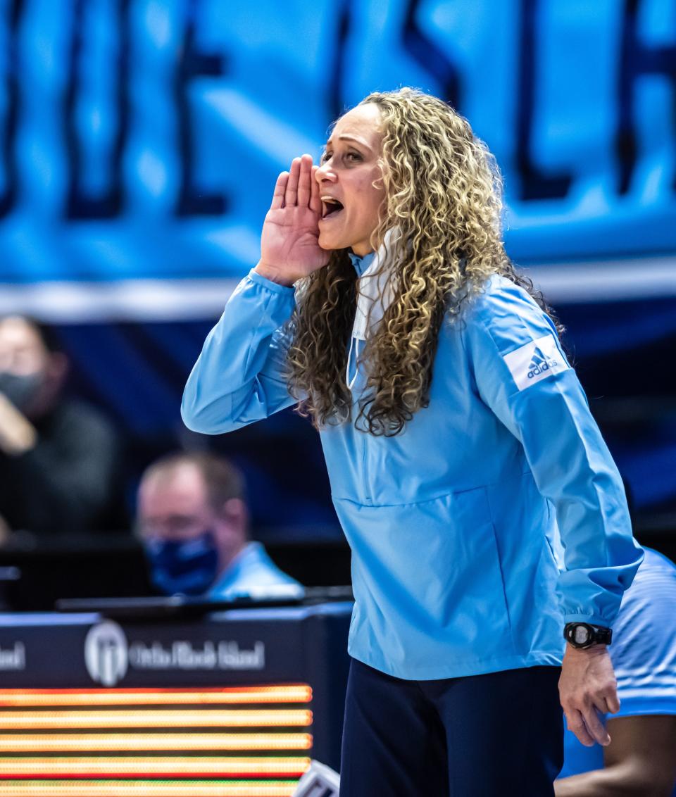URI women's basketball coach Tammi Reiss shouts instructions from the sidelines at a recent game.