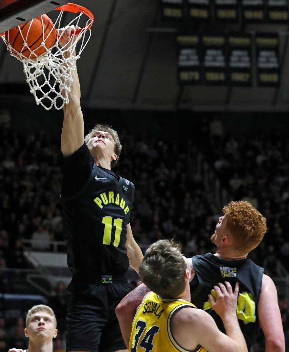 Purdue Boilermakers forward Brian Waddell (11) dunks the ball during the NCAA men’s basketball game against the Michigan Wolverines, Tuesday, Jan. 23, 2024, at Mackey Arena in West Lafayette, Ind. Purdue Boilermakers won 99-67.