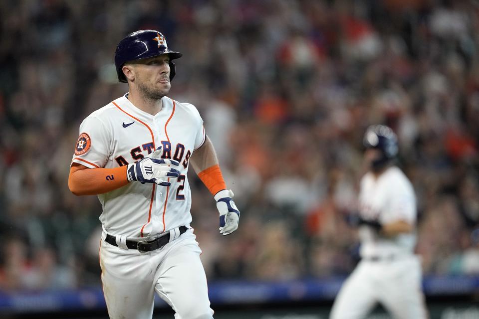 Houston Astros' Alex Bregman (2) runs up the first base line after hitting an RBI single against the New York Mets during the fourth inning of a baseball game Wednesday, June 21, 2023, in Houston. (AP Photo/David J. Phillip)