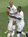 <p>Portugal scorer Cristiano Ronaldo, left, and his teammates celebrate the opening goal against Morocco </p>