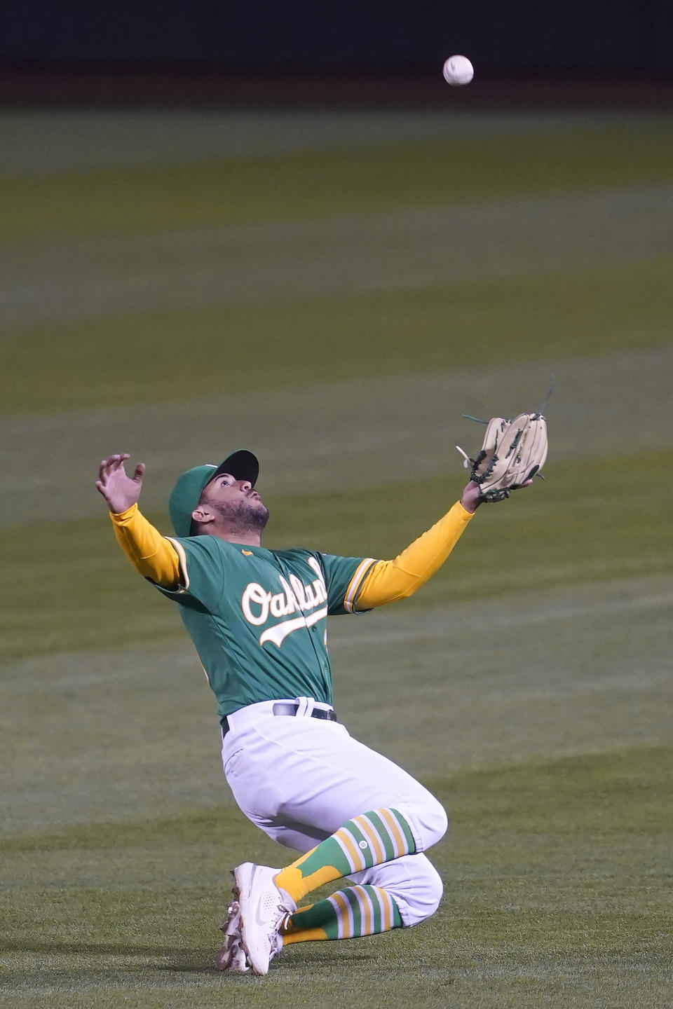 Oakland Athletics second baseman Vimael Machin catches a fly out hit by Minnesota Twins' Willians Astudillo during the fifth inning of the second baseball game of a doubleheader in Oakland, Calif., Tuesday, April 20, 2021. (AP Photo/Jeff Chiu)