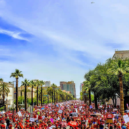 People march in front of the Capitol in Phoenix, Arizonia, U.S., April 26, 2018 in this picture obtained from social media. Jeremy Whittaker, City of Mesa Councilman/via REUTERS