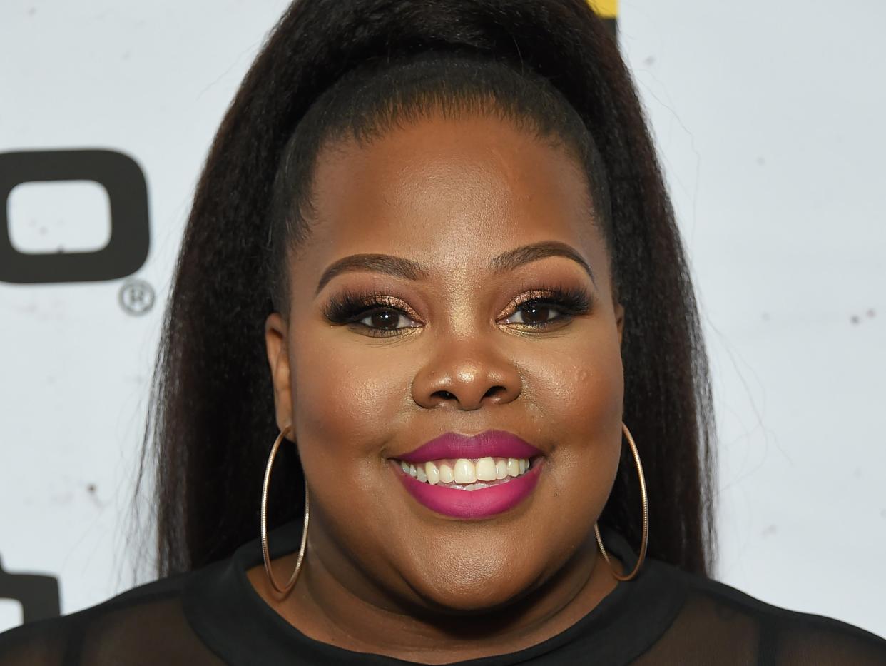 Amber Riley claims she experienced harassment from an ‘older white man’ wearing a Trump hat (Rex Features)