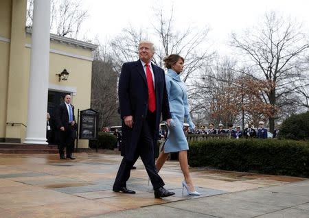 President-elect Donald Trump and his wife Melania depart from services at St. John's Church during his inauguration in Washington, U.S., January 20, 2017. REUTERS/Joshua Roberts