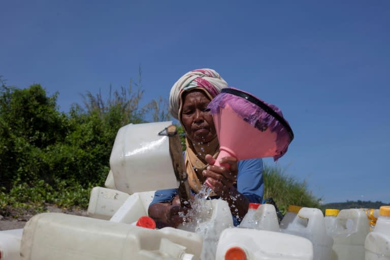 The work of water collectors like Rohana is vital for the families in her remote village where residents have long complained about limited access to clean water
