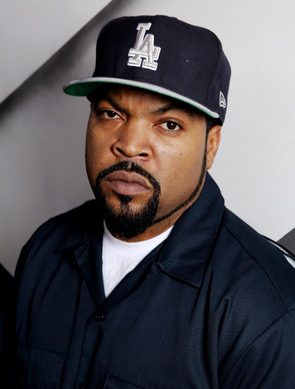 In this Tuesday, Feb. 11, 2014 photo, Ice Cube poses for a portrait in Los Angeles. Ice Cube co-starred with Kevin Hart in the film, "Ride Along," which has made over $134.6 million worldwide. (Photo by Matt Sayles/Invision/AP)