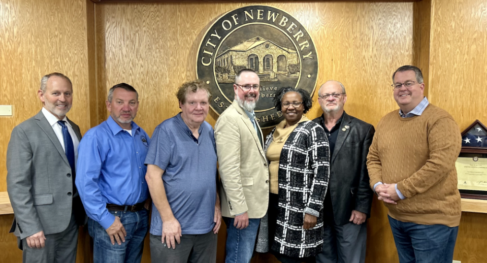 The cities of Archer and Newberry have reached an agreement to build a regional wastewater treatment facility. Pictured, from left, are Newberry City Manager Mike New, Newberry Commissioners Mark Clark and Monty Farnsworth, Newberry Mayor Jordan Marlowe, Archer Mayor Iris Bailey, Archer City Manager Tony Hammond and Newberry City Commissioner Tim Marden.