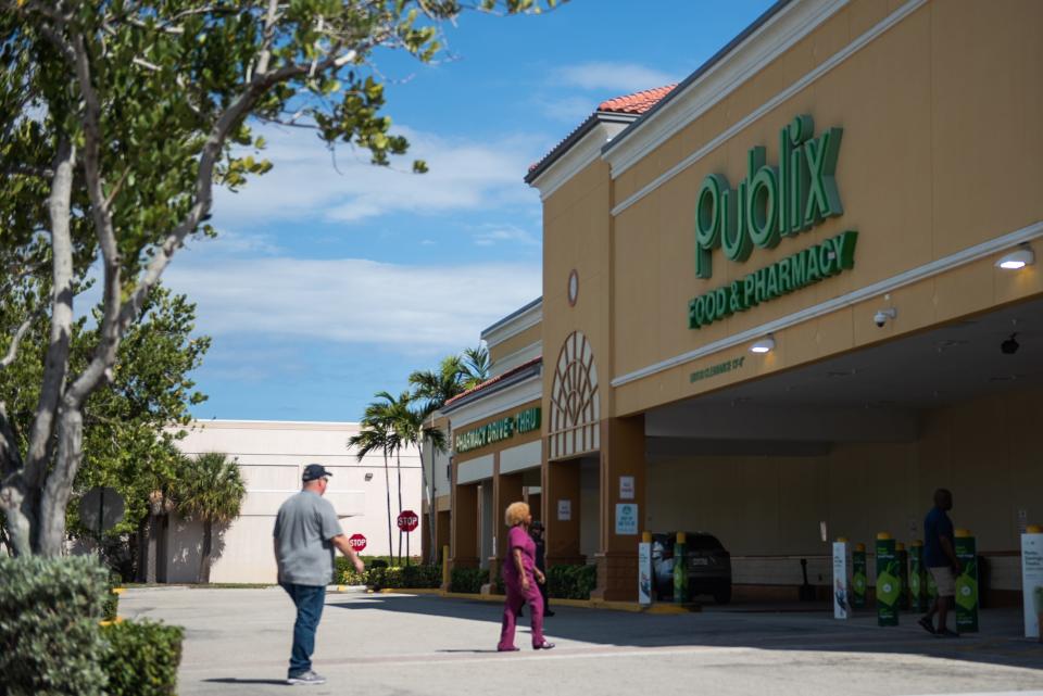 Customers enter the Publix located at the former site of the Twin City Mall, at the southwest corner of US 1 and Northlake Boulevard, in North Palm Beach, Fla., on Wednesday, April 6, 2023.