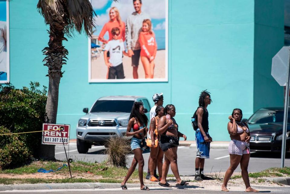 Spring breakers walk along Highway 90 during Black Spring Break in Biloxi on Saturday, April 13, 2024