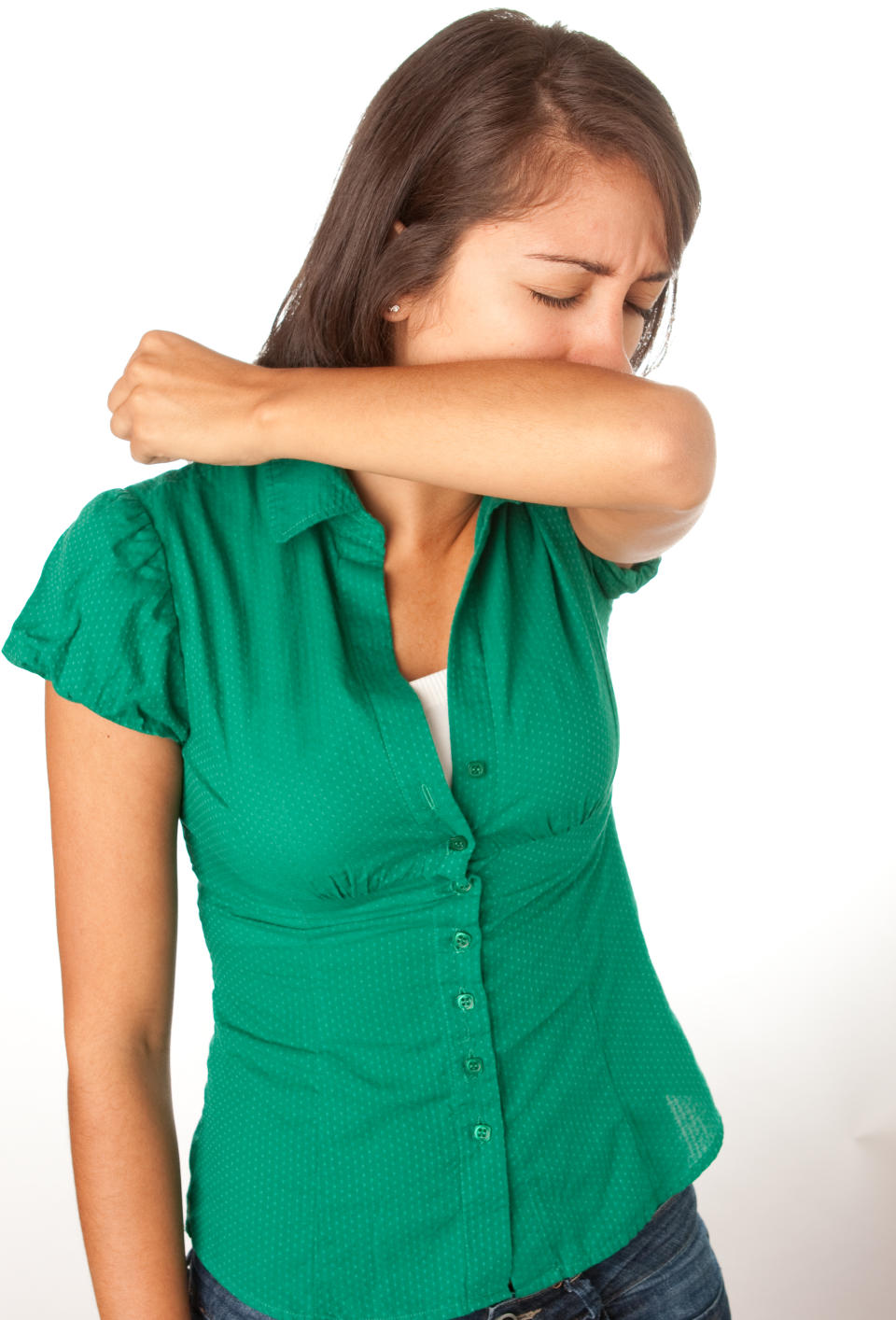 Woman Coughing into Elbow