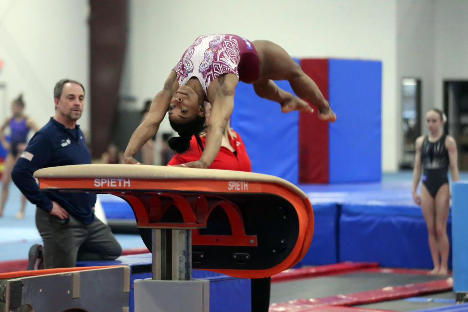 Simone Biles launches off a vault during training at the Stars Gymnastics Sports Center in Katy, Texas, Monday, Feb. 5, 2024. Biles begins preparations for the Paris Olympics when she returns to competition at the U.S. Classic in Hartford, Connecticut on Saturday. Biles, who cited mental health concerns while removing herself from several competitions at the Tokyo Olympics, says she is better prepared for the pressure competing presents this time around. (AP Photo/Michael Wyke)