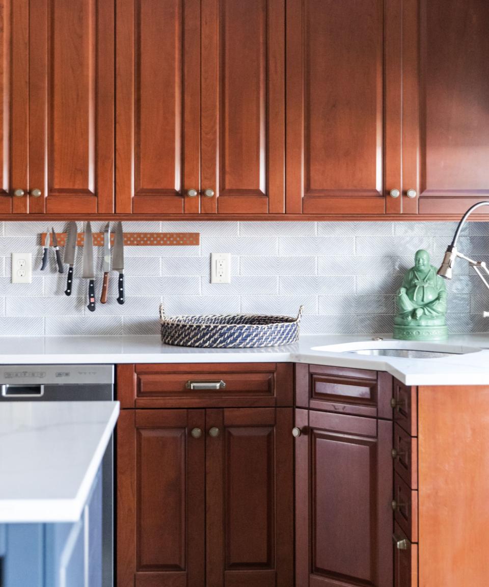 kitchen with dark wood units and blue island