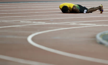 Atletismo - Campeonato Mundial de Atletismo - Final Posta Masculina 4x100 Metros - Estadio de Londres, Londres, Reino Unido – 12 de agosto, 2017. Usain Bolt de Jamaica reacciona después de la final. REUTERS/Phil Noble