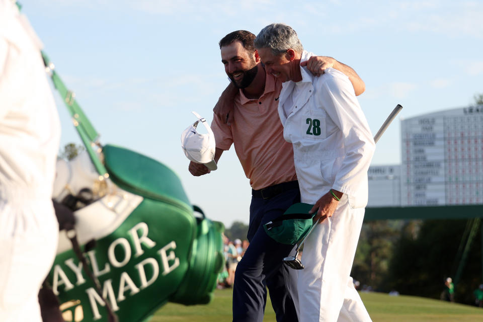 AUGUSTA, GEORGIA - APRIL 14: Scottie Scheffler of the United States and caddy Ted Scott celebrate on the 18th green after winning the 2024 Masters Tournament at Augusta National Golf Club on April 14, 2024 in Augusta, Georgia.  (Photo by Warren Little/Getty Images)