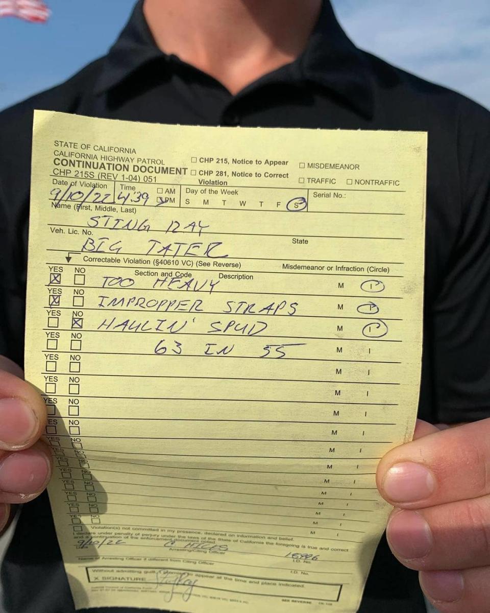 Sting Ray Robb displays the citation given to him for driving the Big Idaho Potato truck at the Firestone Grand Prix of Monterey in September.