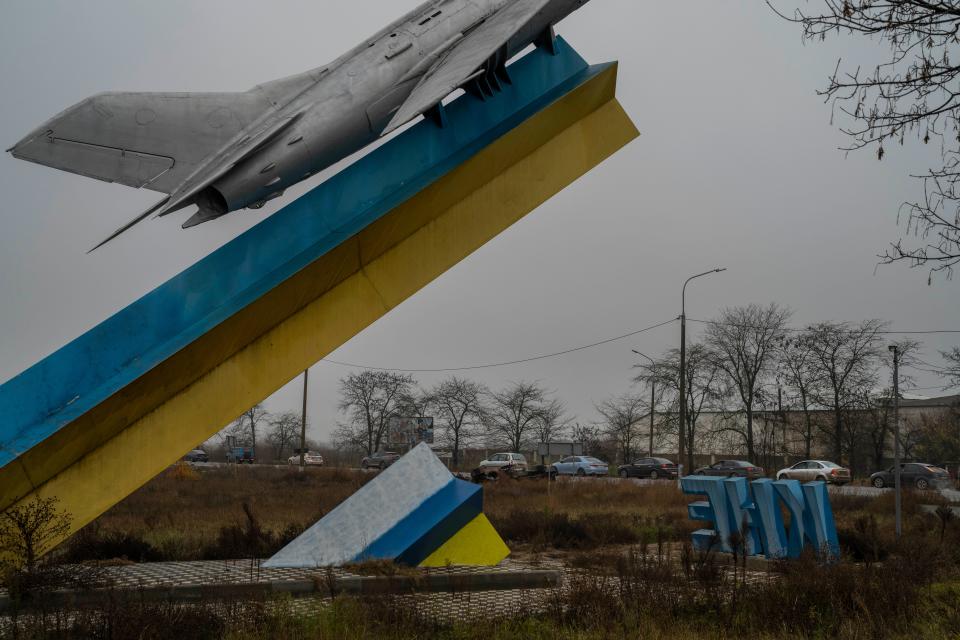 Cars pictured queueing to leave Kherson on Saturday (AP Photo/Bernat Armangue)