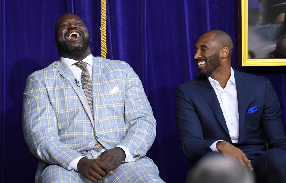 Shaquille O’Neal and Kobe Bryant share a laugh during the unveiling of Shaq’s statue outside Staples Center. (AP)