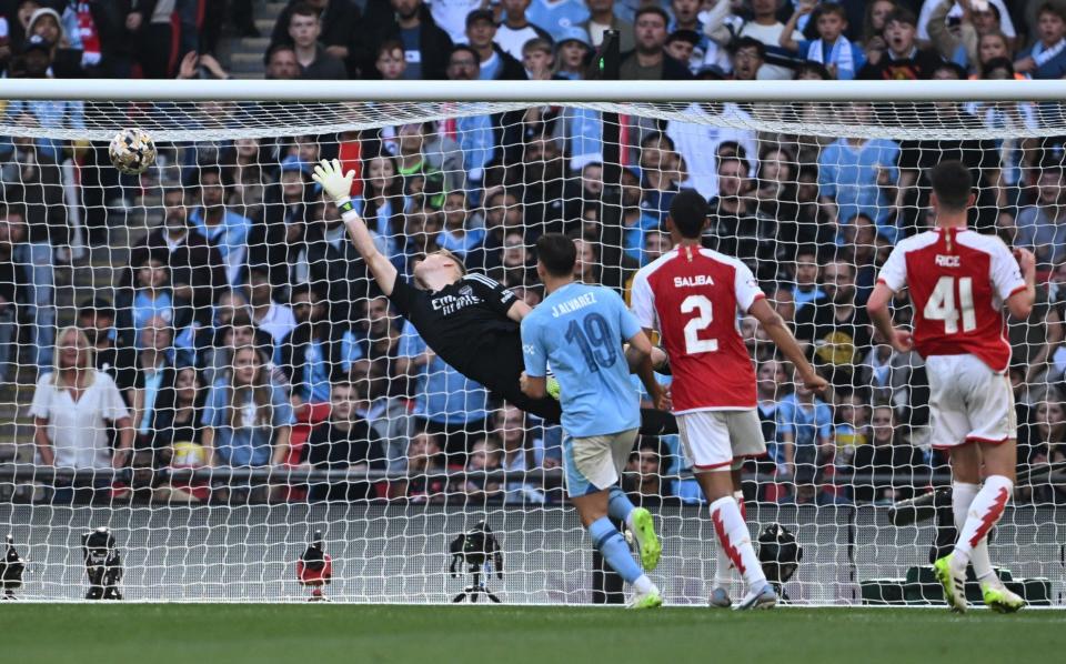 Manchester City's Cole Palmer scores their first goal past Arsenal's Aaron Ramsdale