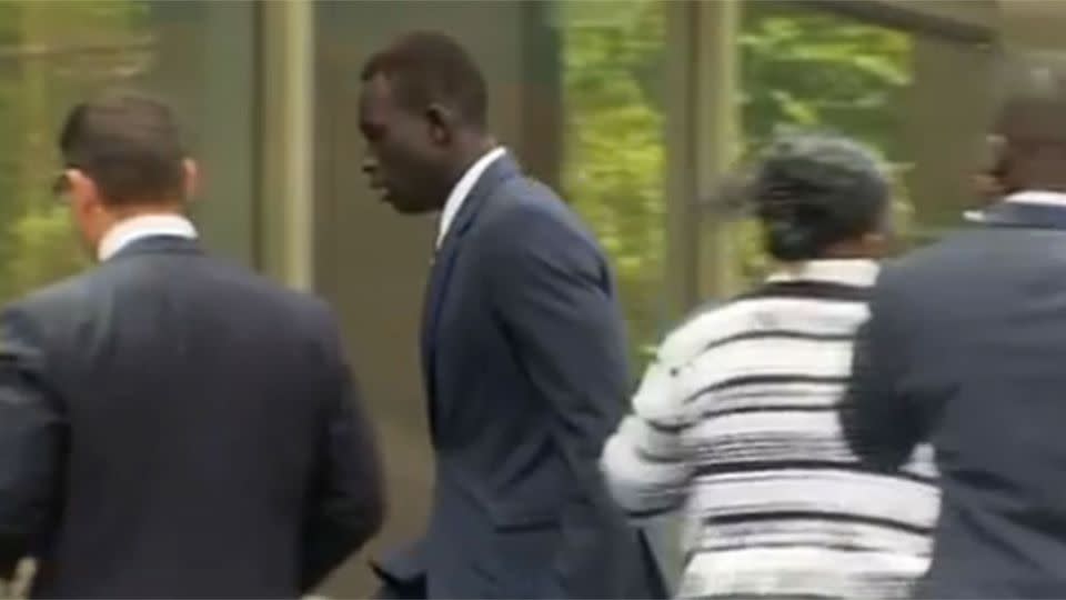 Majak Daw outside the Victorian County Court.