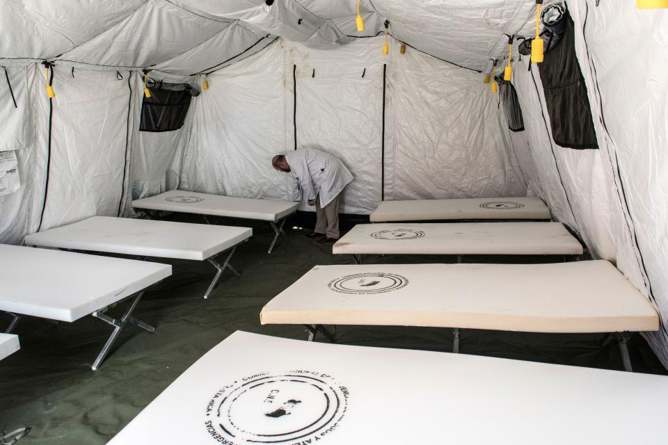 A medical doctor checks inputs inside a tent at a military hospital donated by the US government to assist COVID-19 cases in San Jose, Costa Rica, March 17, 2020. - Costa Rica has confirmed 50 cases of the new coronavirus. (Photo by Ezequiel BECERRA / AFP) (Photo by EZEQUIEL BECERRA/AFP via Getty Images)