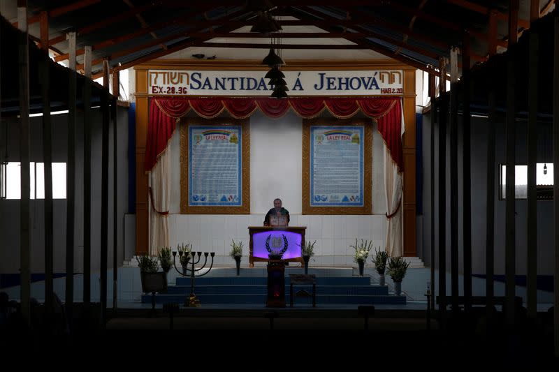 A church leader speaks during a worship service of the Christian evangelical church Israelite Mission of the New Universal Pact at the group’s main temple, on the outskirts of Lima