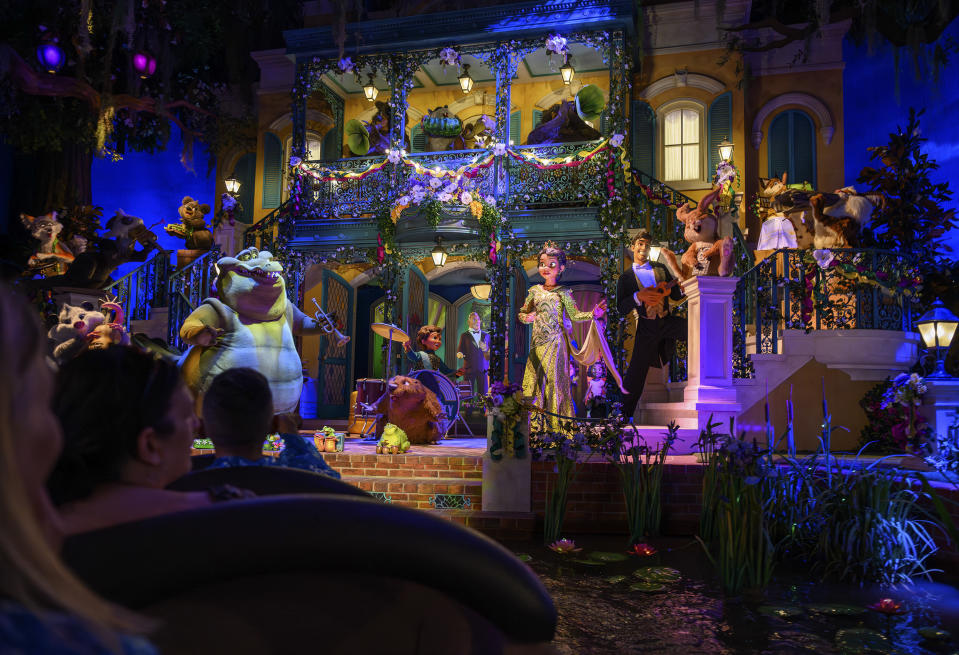 Guests pass a scene with Tiana and her trump-playing alligator pal, Louis, on the Tiana's Bayou Adventure flume ride at Disney's Magic Kingdom Park at Walt Disney World in Lake Buena Vista, Fla., June 3, 2024. Splash Mountain was closed last year because of its connection to a racist film. Disney overhauled it to focus on Tiana, Disneyâs first Black princess, drawing praise and backlash. (Todd Anderson/The New York Times) 