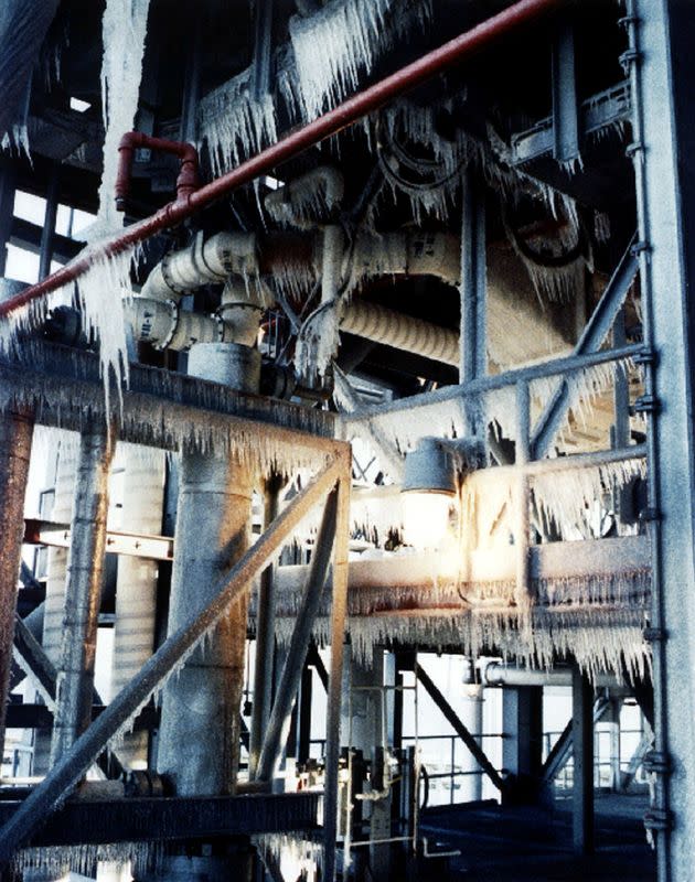 FILE PHOTO: FILE PHOTO 28JAN86 - Ice on the launch pad of the Space Shuttle Challenger is shown in inspection pi..