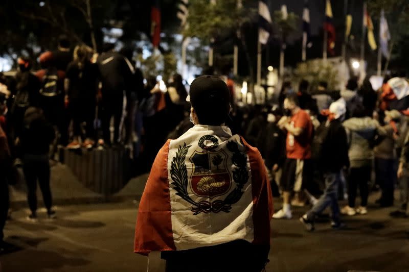 People gather outside Congress after Peru's interim President Manuel Merino announced his resignation, in Lima