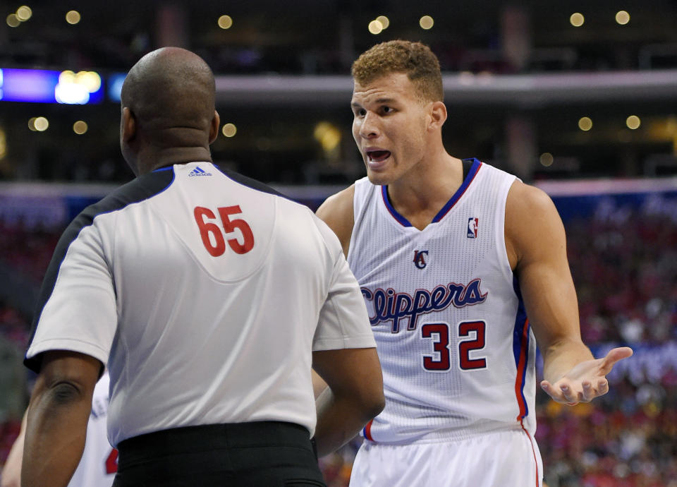 Los Angeles Clippers forward Blake Griffin, right, talks to referee Sean Wright after receiving his fifth foul of the game during the second half in Game 1 of an opening-round NBA basketball playoff series against the Golden State Warriors, Saturday, April 19, 2014, in Los Angeles. The Warriors won 109-105. (AP Photo/Mark J. Terrill)