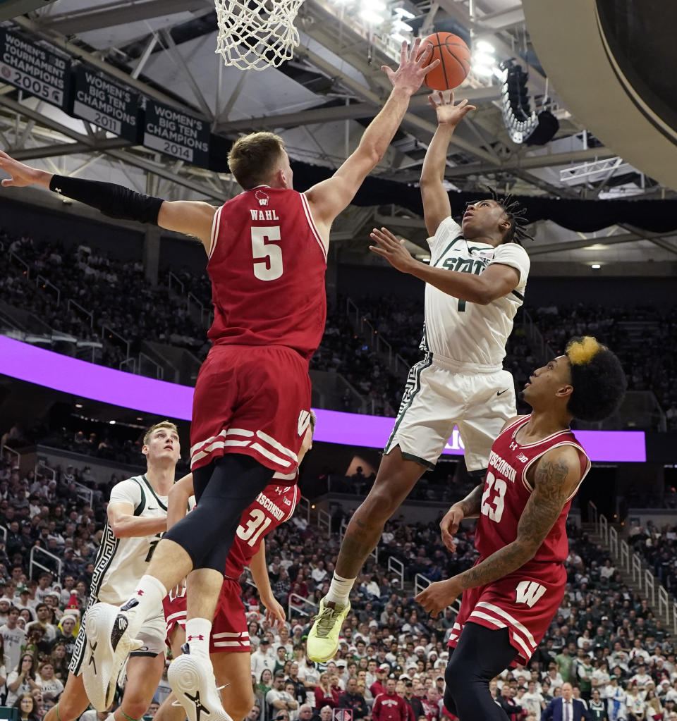 Michigan State guard Jeremy Fears Jr. (1) shoots over the defense of Wisconsin forward Tyler Wahl (5) during the second half of an NCAA college basketball game, Tuesday, Dec. 5, 2023, in East Lansing, Mich. (AP Photo/Carlos Osorio)