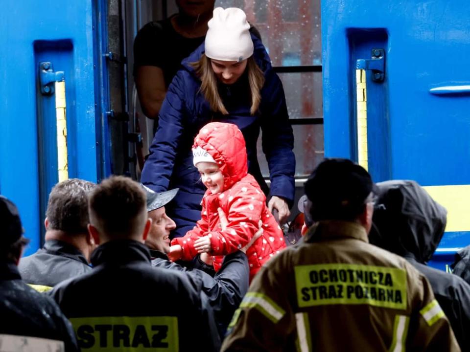 A Ukrainian refugee girl arrives on a train from Odesa at Przemysl Glowny train station, after fleeing the Russia's invasion of Ukraine, in Poland, April 9, 2022. (Leonhard Foeger/Reuters - image credit)