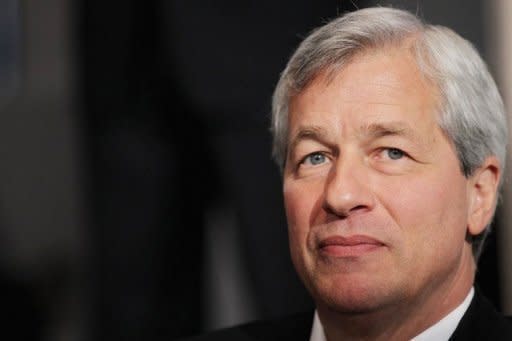 JPMorgan Chase's shares were pummeled and politicians blasted its CEO Jamie Dimon, pictured, after the bank reported a shock $2 billion derivatives loss that even the pugnacious chief executive called "egregious."