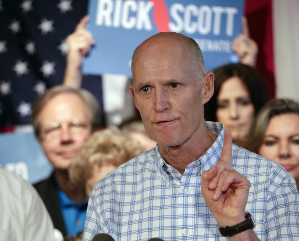 FILE - In this Sept. 6, 2018, file photo, Florida Gov. Rick Scott speaks to supporters at Republican rally in Orlando, Fla. Top Florida Republicans including Scott have been quick to say President Donald Trump is wrong about the death toll in Puerto Rico. Scott said he disagreed with the president and that he has seen the “devastation firsthand.” (AP Photo/John Raoux, File)